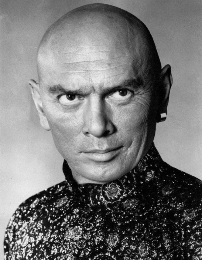 Actor Yul Brynner popularized a shaved head in the 1950s