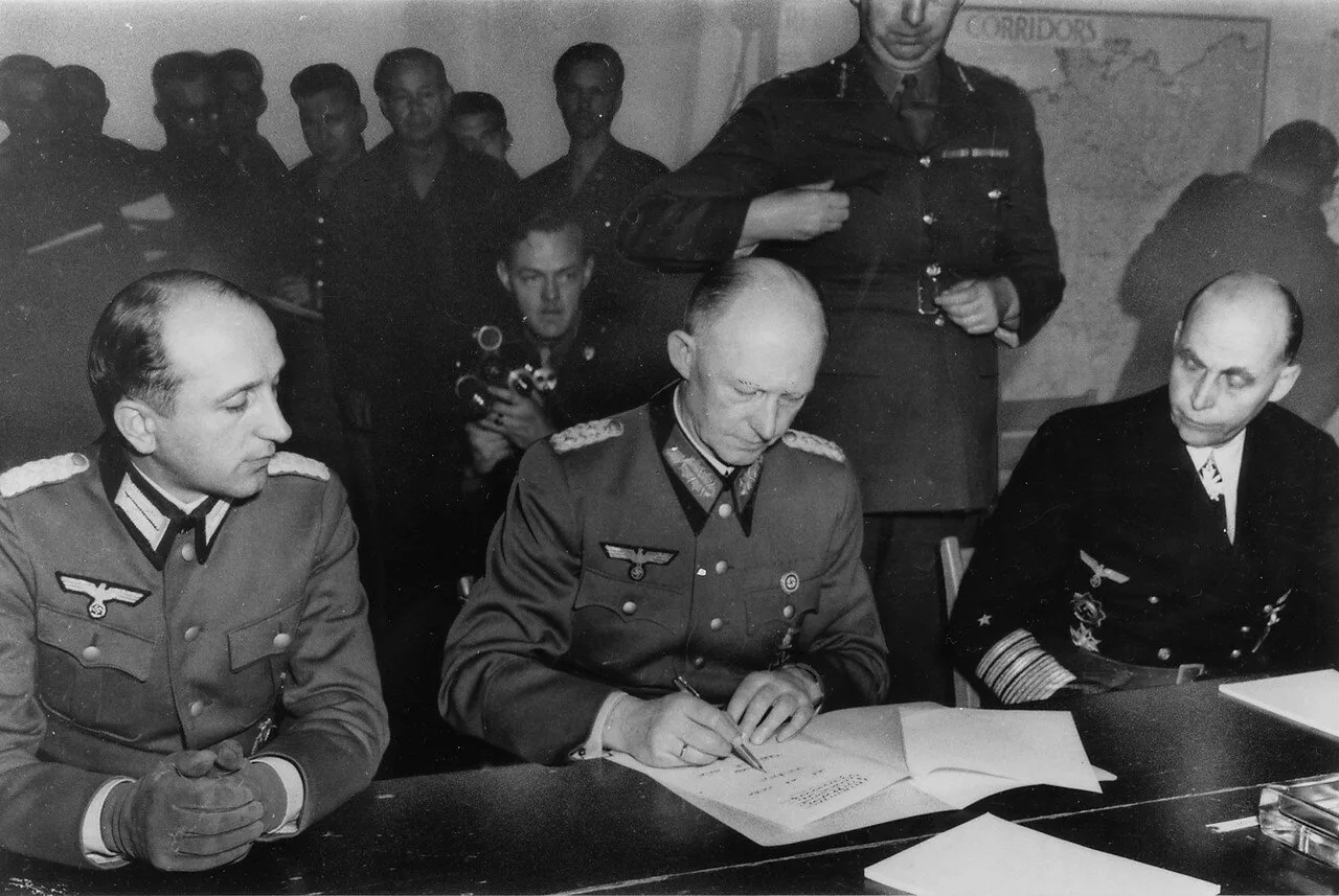 General Alfred Jodi signing surrender papers.