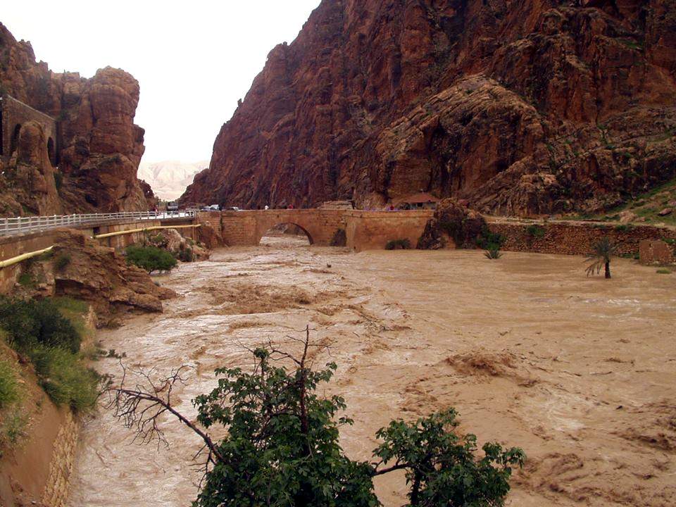 Floodwaters engulf the area and bridge in Algeria