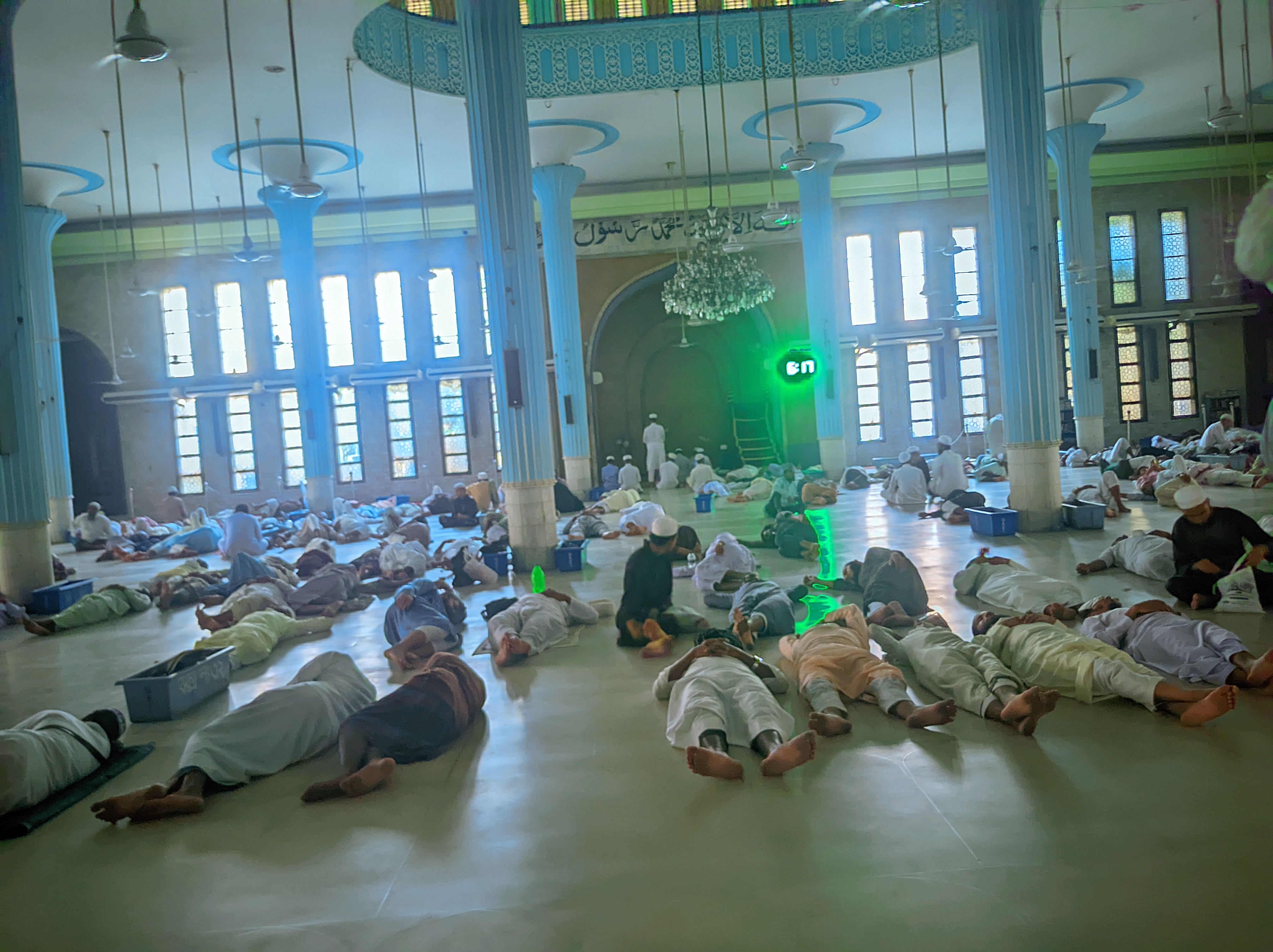 Long-Distance Participants Resting at Baitul Mukarram Before the Rally