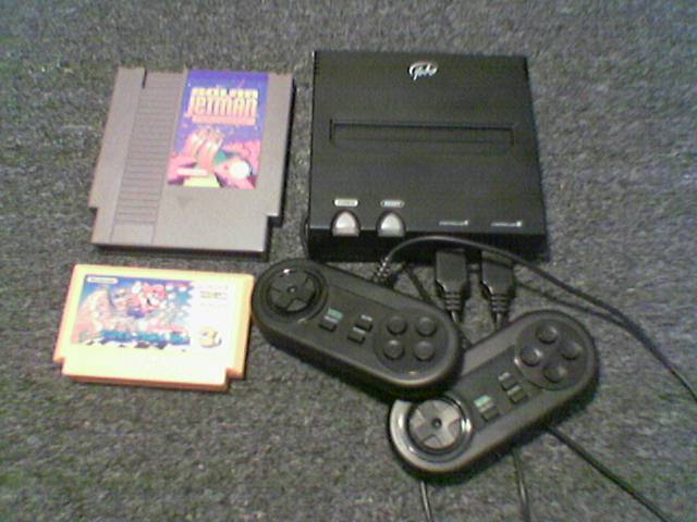The FC Game Console beside Japanese and European/US cartridges