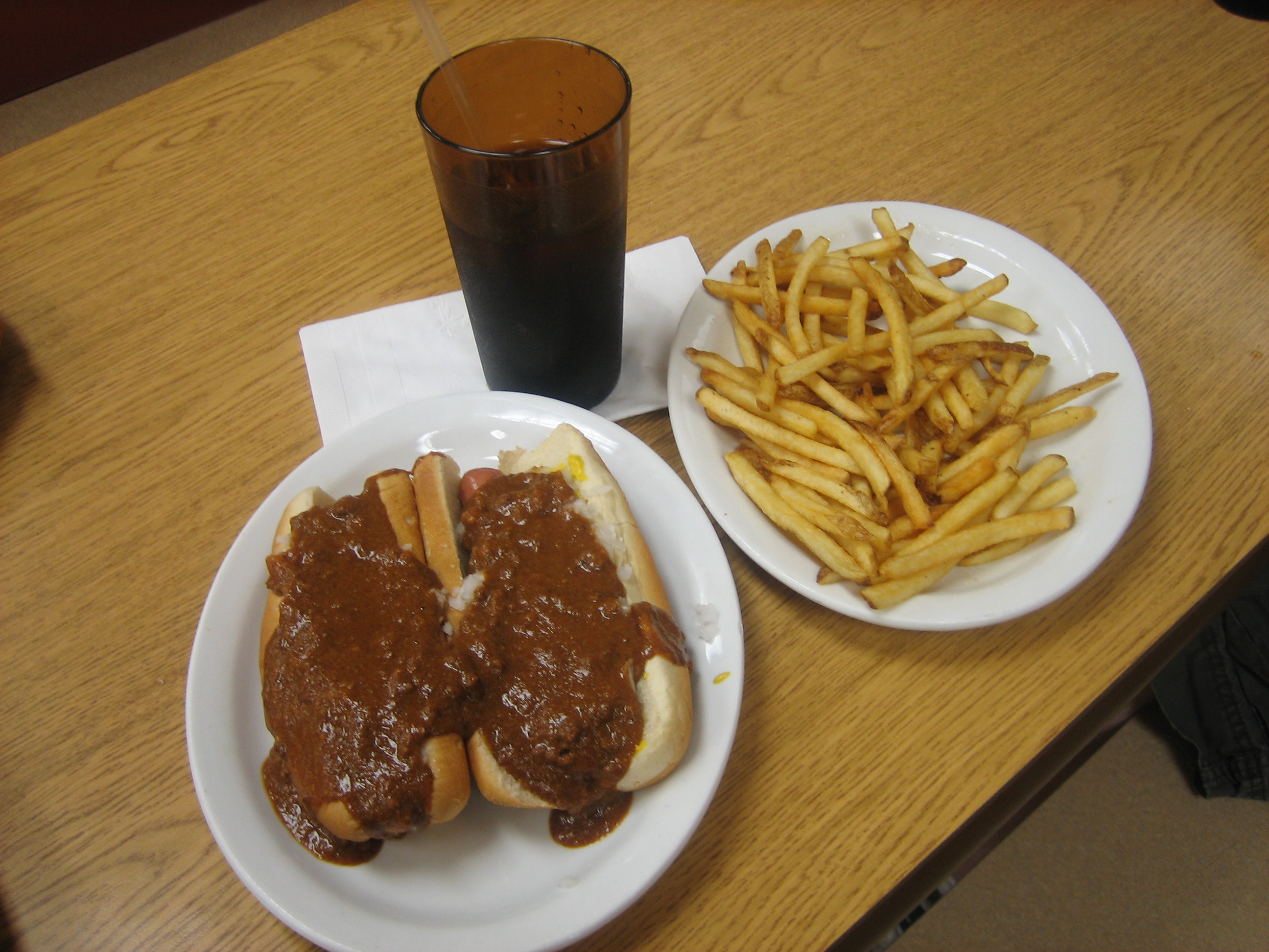A typical Louie's meal consisting of two Red Hots, french fries, and a Pepsi