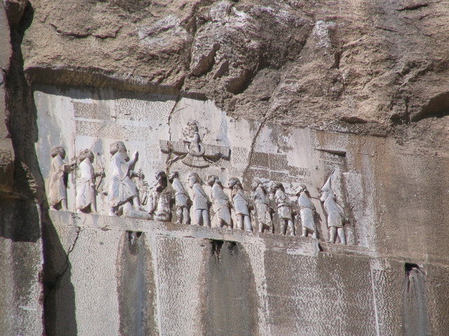 The Behistun Inscription, carved into a cliffside, gives the same text in three languages, telling the story of King Darius'