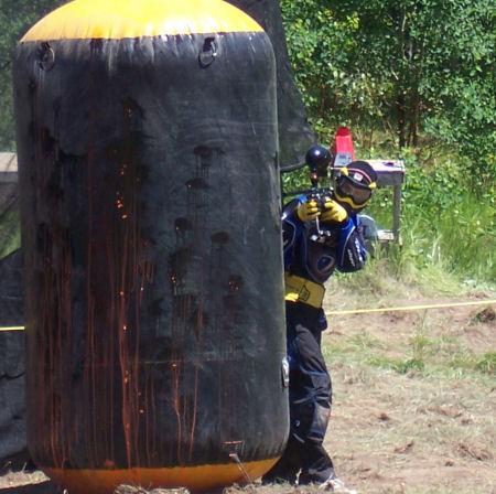 A tournament player shooting from behind an inflatable bunker usually called a 'can'.