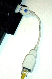 A typical PCMCIA card dongle|right