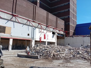 Interior view of the former Go Outdoors superstore (ex-Tesco), Chatham, showing demolition debris and exposed support structures (2025).