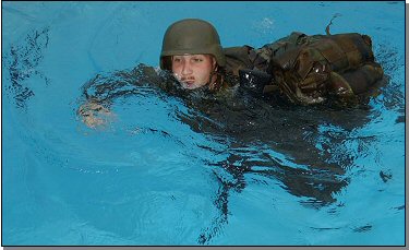 A Marine undergoes water survival training