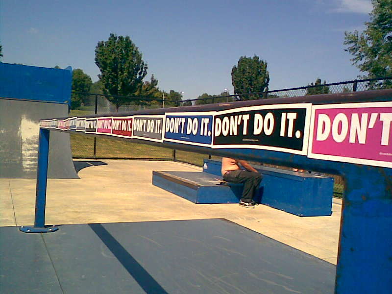  Don't Do It Stickers at a Skatepark.
