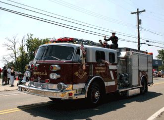 U.S. Marine Steven Turpin atop Engine 2 at the PH Memorial Day Parade