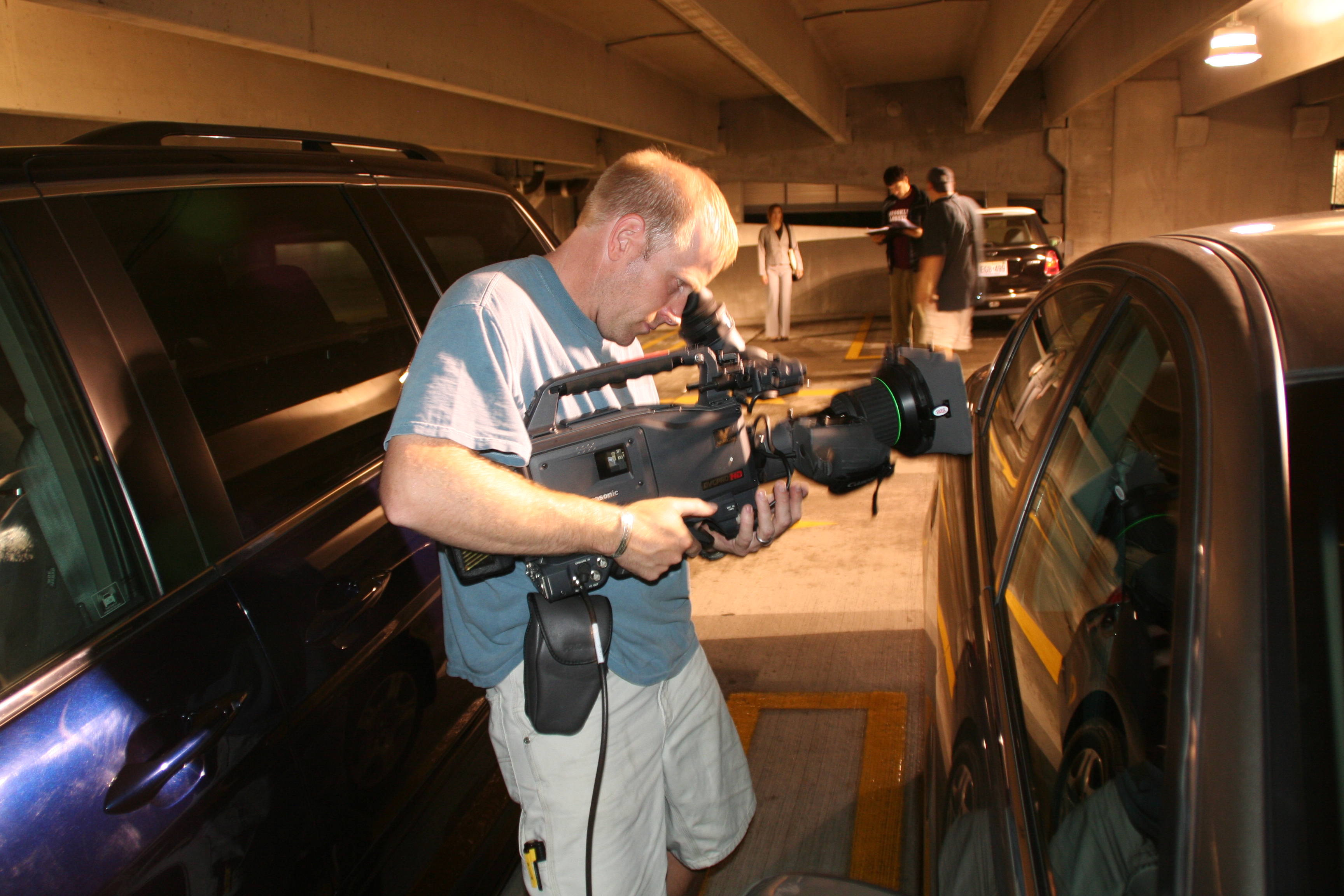 Bud Hayman, Director of Photography for TAKE OUT sets up a point of view shot
