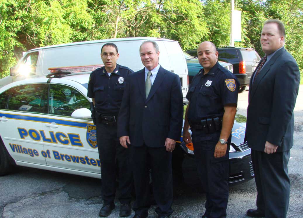 Degnan with members of the Brewster police force.
