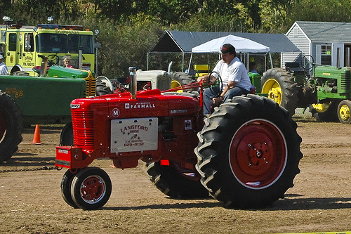 A Farmall tractor getting ready to pull.