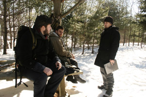 Tim Bissell speaking with Tyler Brent (closest) and Charles Lo Manto on set