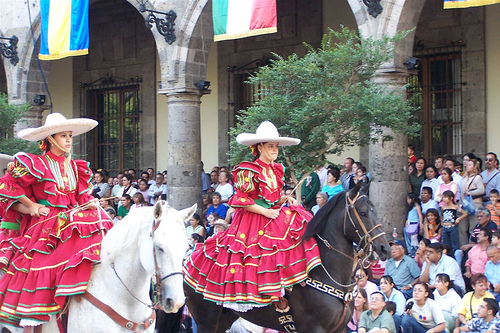Escaramuza members in a parade in Mexico