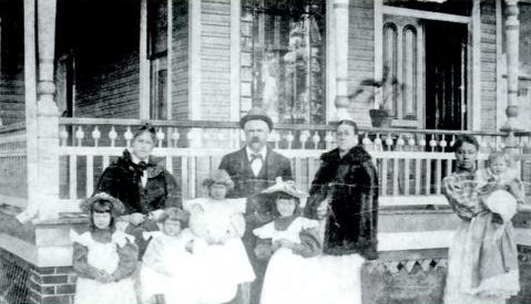 Nebraska House in the late 1890s. John Atwood (center) with wife (right). In front are his four daughter (Edith, Virginia, Jacqueline & Lynolee. Son (John) held by servant.
