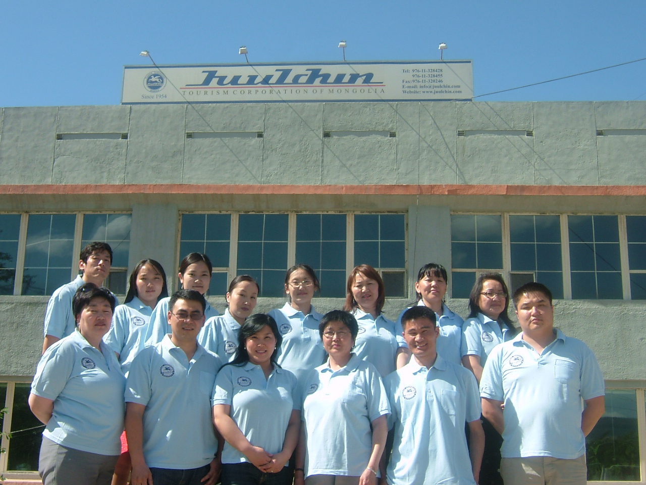 The main building and staff of the Juulchin Tourism Corporation of Mongolia