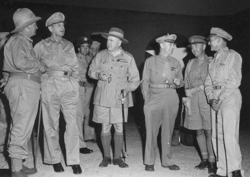 Senior Allied commanders in New Guinea in October 1942. Left to right: Mr Frank Forde (Australian Minister for the Army); MacArthur; General Sir Thomas Blamey, Allied Land Forces; Lieutenant General George C. Kenney, Allied Air Forces; Lieutenant General Edmund Herring, New Guinea Force; Brigadier General Kenneth Walker, V Bomber Command.|alt=Six men wearing a variety of different uniforms.