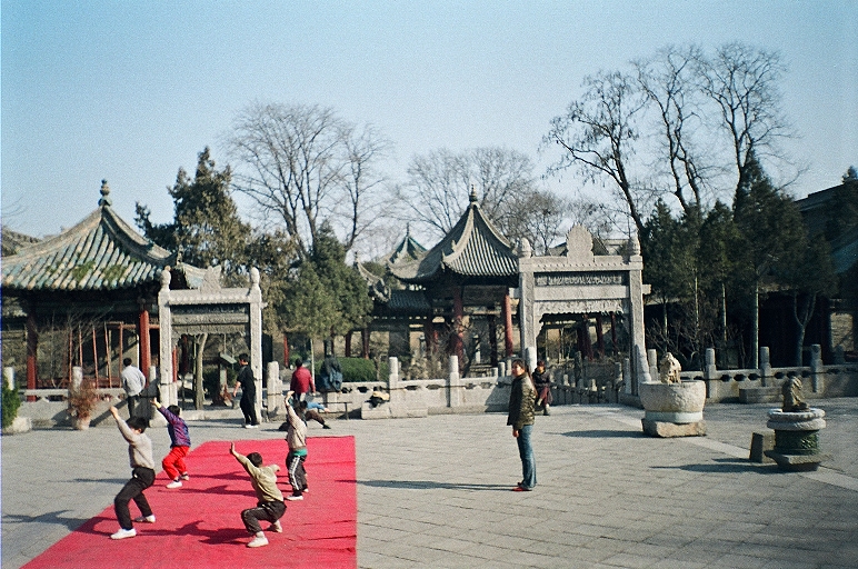 280 px|A group of school children practice martial arts formation under the watch of their teacher in the Great Mosque of Xi'an.