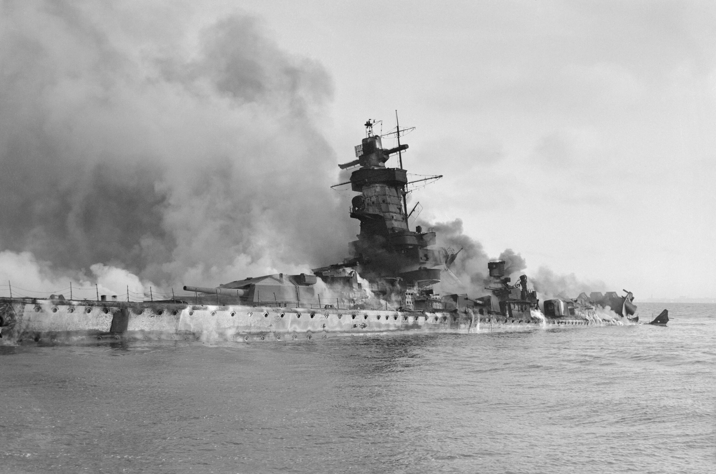 Admiral Graf Spee in flames after being scuttled in the River Plate Estuary off Montevideo, Uruguay.