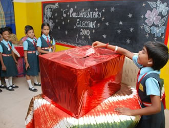 A child seen casting her vote during the Parliamentary election
