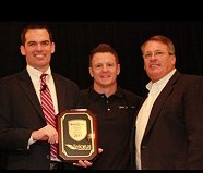 Ron McNab and Charles Lomond of AireSpring present the 2011 Partner Elite award to Adam Edwards of Telarus, Inc.
