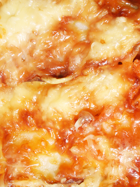 The cheese on top of the kalliopi ready to be served