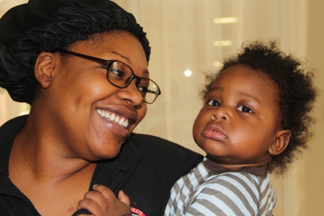 Female veteran and child after finding affordable housing in Miami. Female veteran and child after finding affordable housing in Miami.