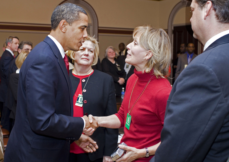 President of the United States Obama shaking hands with Beverly Eckert six days before she died.