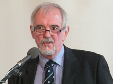 Mike Gaston addressing a community mediators conference in Belfast.