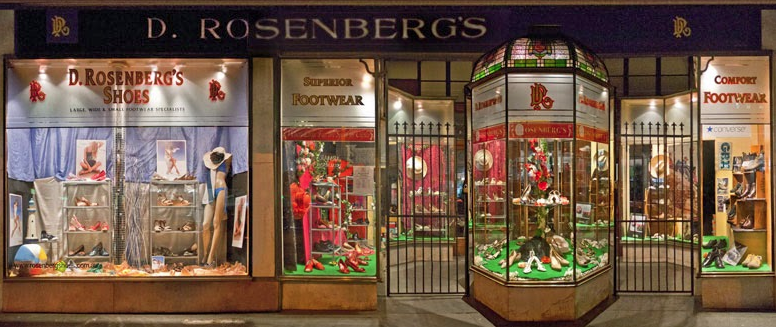 Rosenberg shoes store front. This picture shows the beauty of old style and heritage listed facade consisting of extruded brass and the stain-glass rotunda.