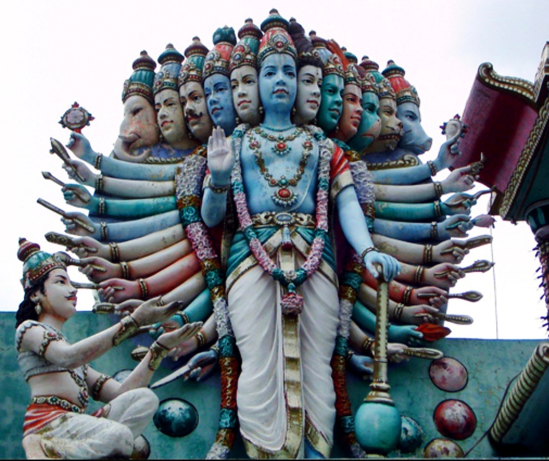 Krishna displays his Vishvarupa (Universal Form) to Arjuna on the battlefield of Kurukshetra.