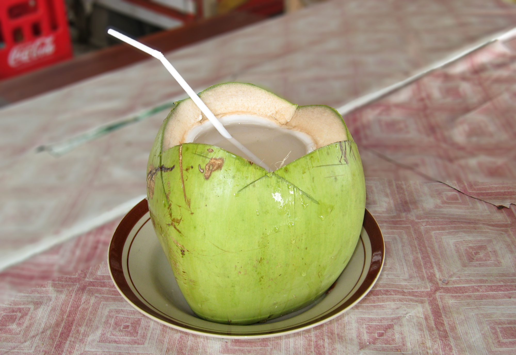 A young coconut, ready to drink, as sold in Pangandaran, Indonesia