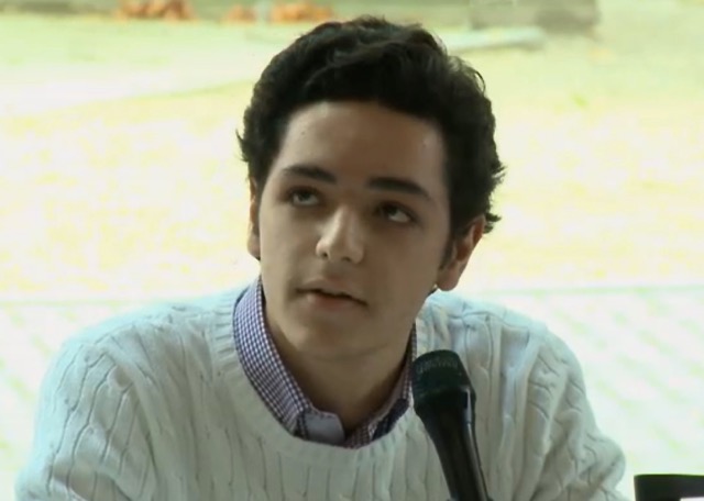 Ducas speaking at a conference