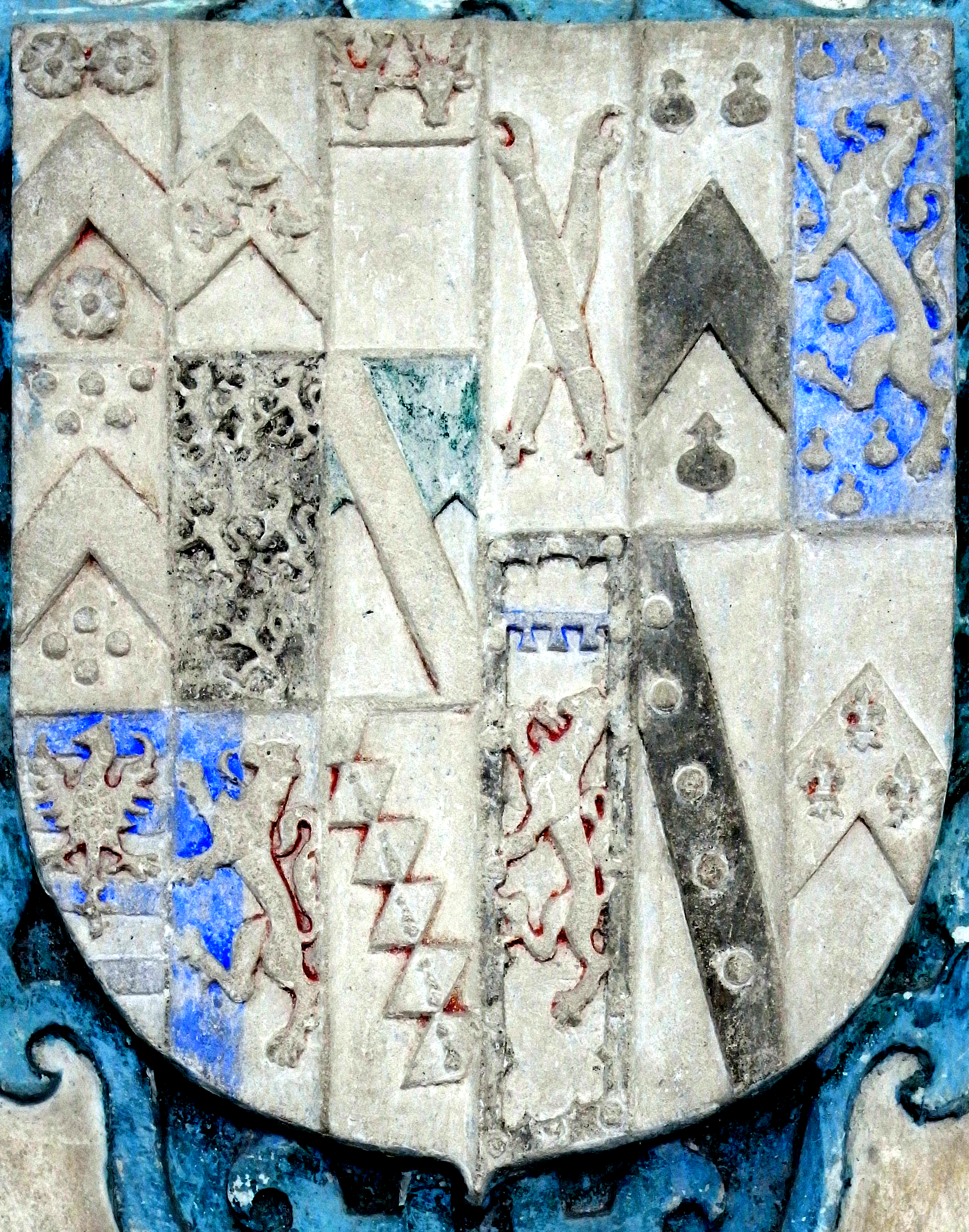 Heraldic escutcheon from mural monument in Branscombe Church, Devon, to Joan Tregarthin (died 1583). The arms are Wadham (9 quarters), impaling Tregarthin (6 quarters). The 4th quarter of the latter is:A lion rampant in chief a label of three points a bordure engrailed bezantee