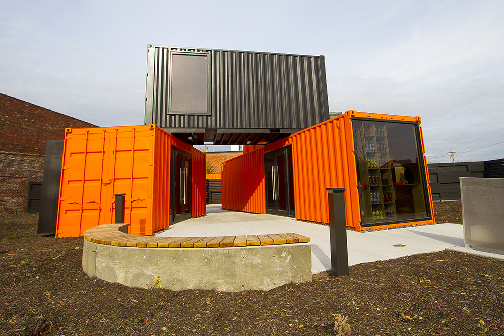 Shipping containers used as a retail shop and visitors center outside of Copper & Kings Brandy Distillery