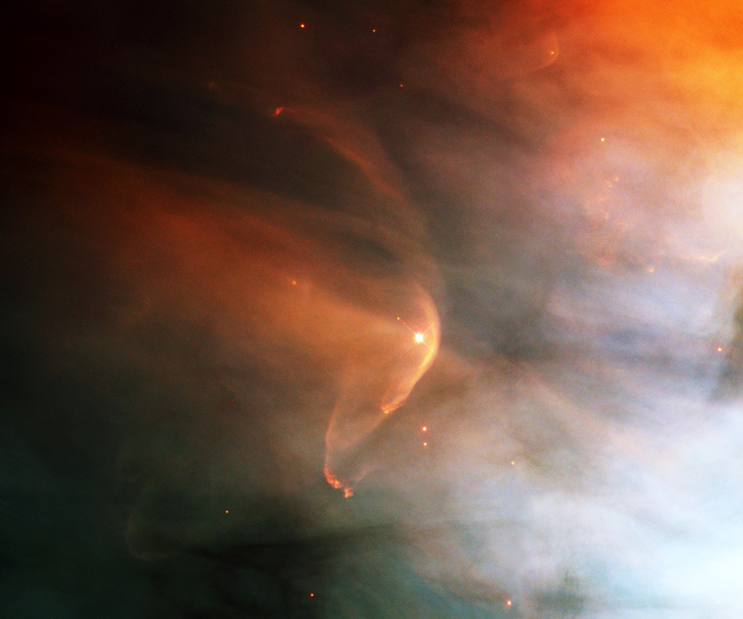 NASA Hubble. Particle Bow Shock of LL Orionis and a distant cousin moving through the Orion nebula. 1995