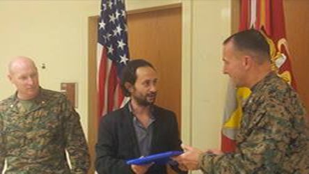 Musoso receives an award from the Commander of the U.S Marines Musoso receives an award from the Commander of the U.S Marines