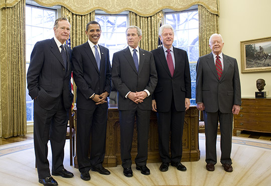 The five living former presidents: George H. W. Bush (far left), Barack Obama (left), George W. Bush (center), Bill Clinton (right), and Jimmy Carter (far right).