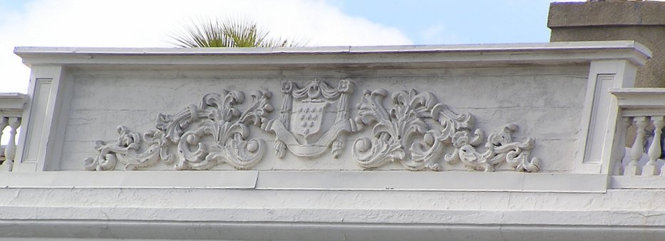 Alston coat-of-arms on parapet at roof