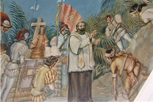 Painting on the ceiling of the circular rotunda that houses the Cross of Magellan in Cebu City depicting the baptism of Carlos and Juana with a statue of the Santo Niño behind Pedro de Valderrama.