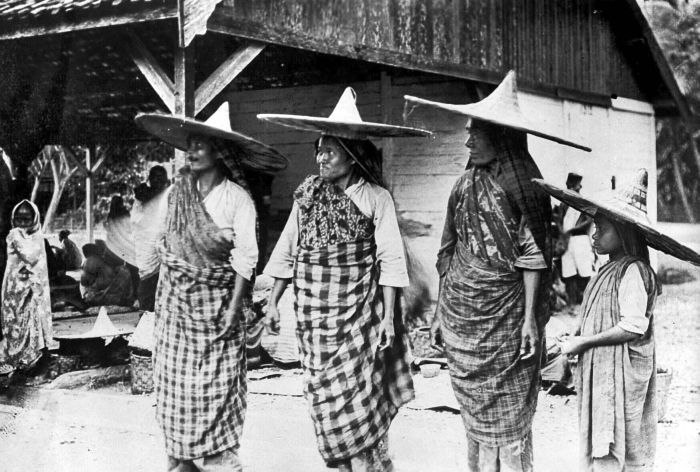 Some women with striking hats on Palue Island.