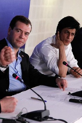 Khan with Dmitry Medvedev, then President of Russia, during the latter's visit to India in 2010|alt=Shah Rukh Khan seated on a panel with Dmitry Medvedev in 2010