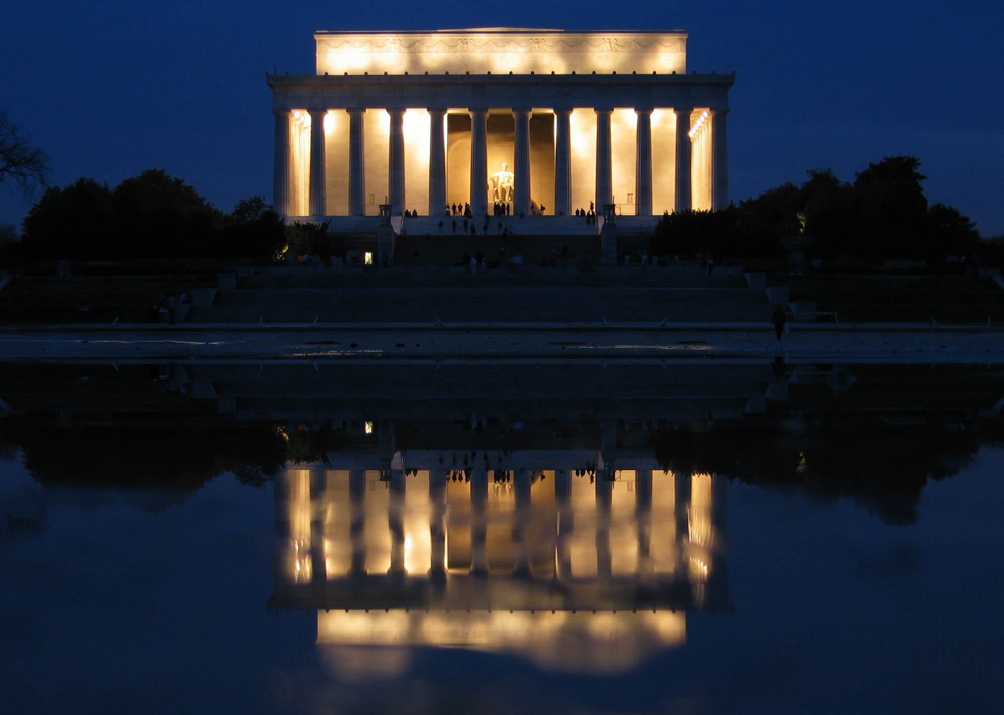 The Memorial is mirrored in the Reflecting Pool at night