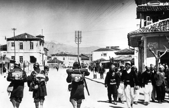 Italian troops passing in front of Albanian civilians, 7 April 1939