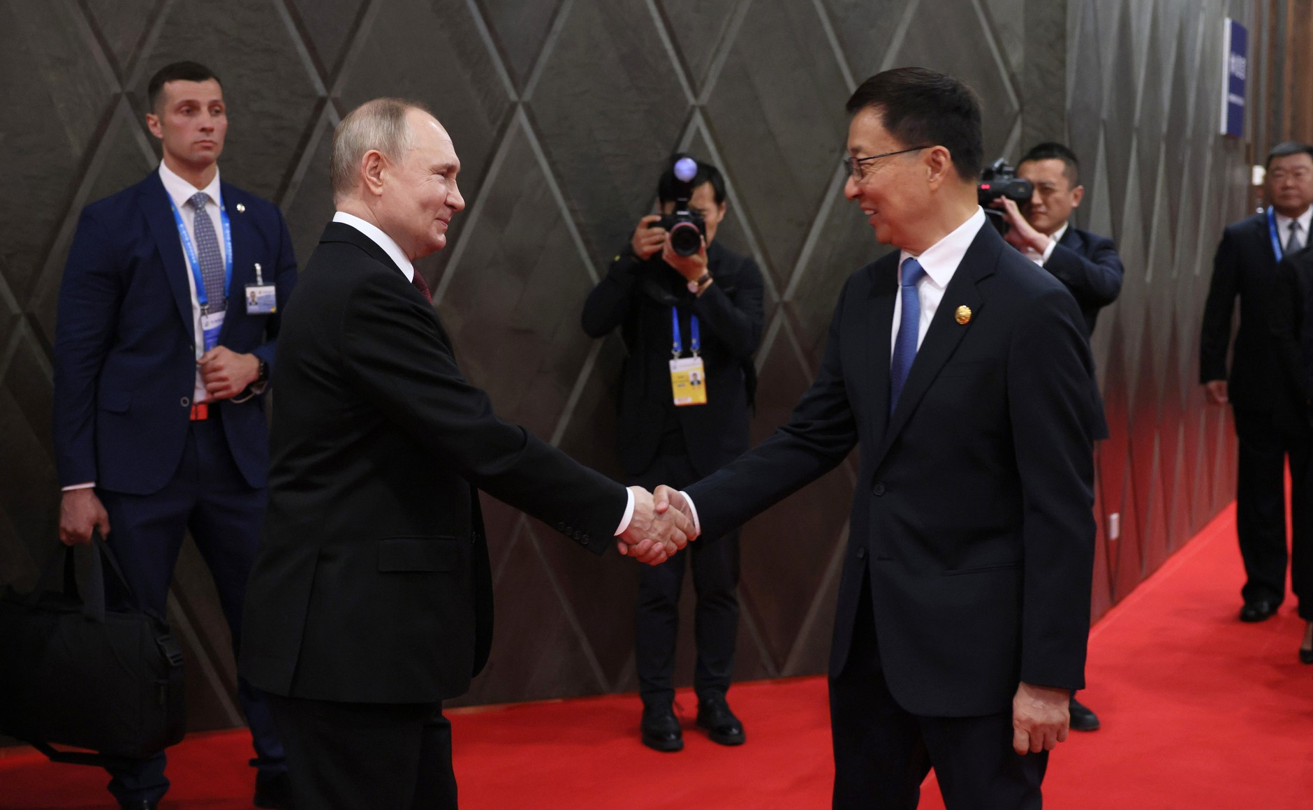 President of Russia Vladimir Putin shaking hands with Han Zheng at the IV China-Russia Expo in Harbin