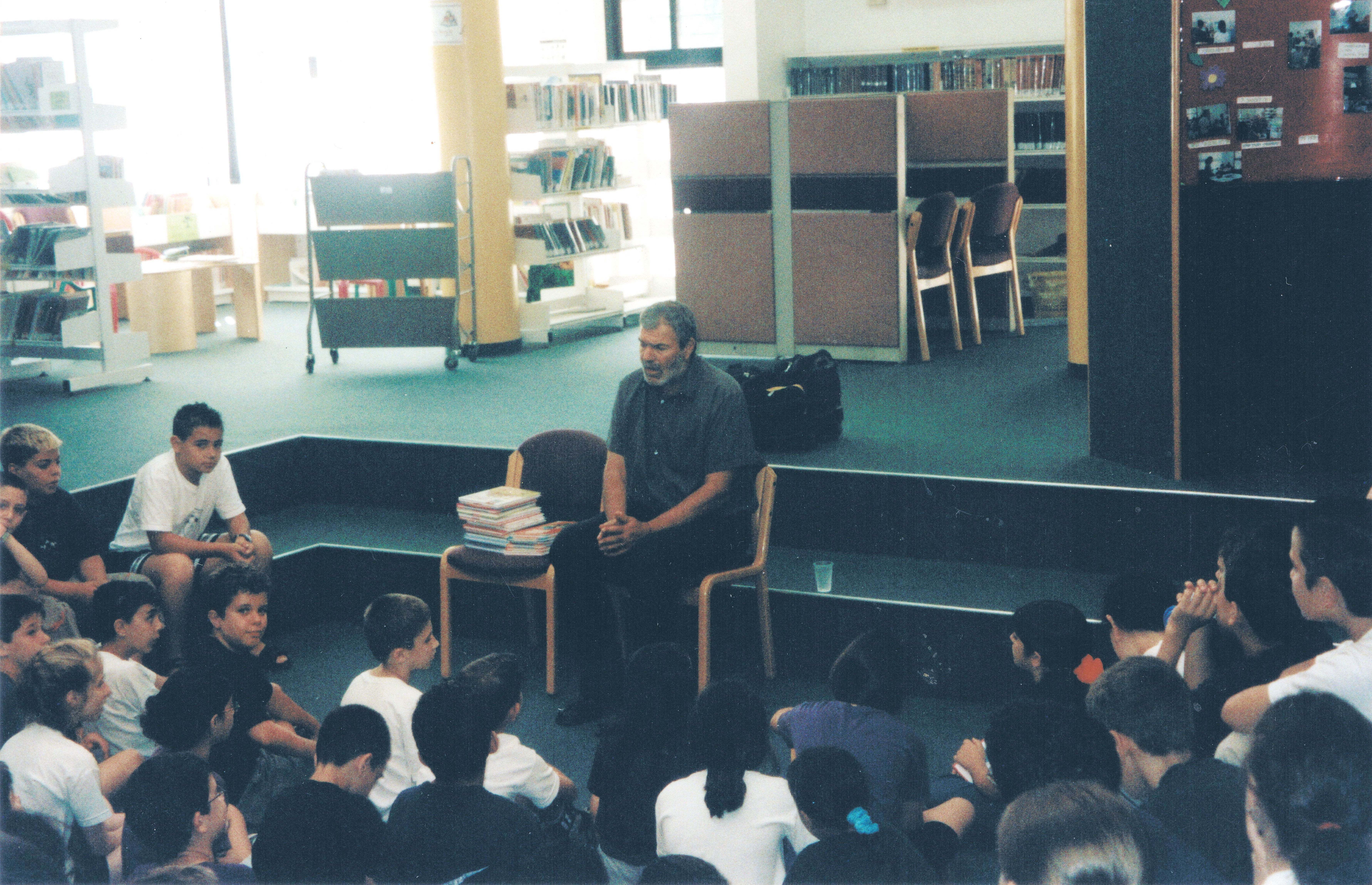Abas meeting with children from Nesher at the municipal library, early 2000s