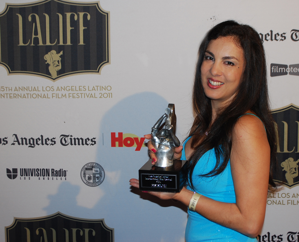 Jackie Di Crystal at the Los Angeles Latino International Film Festival with trophy for Shadows