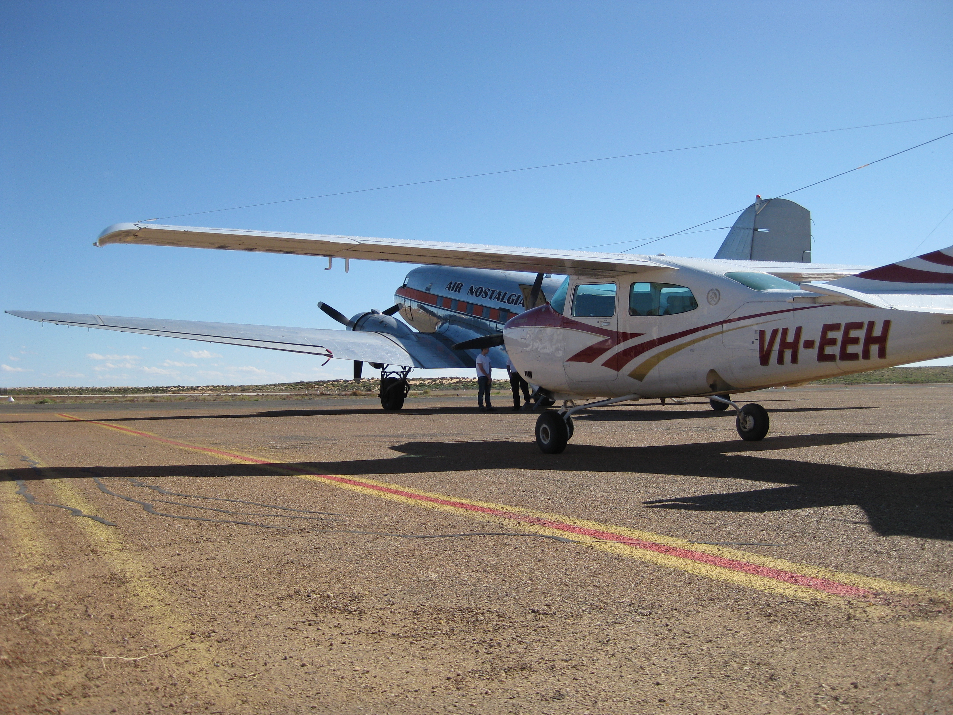 VH-EEH with Air Nostalgia's DC3 re-fuelling at Birdsville