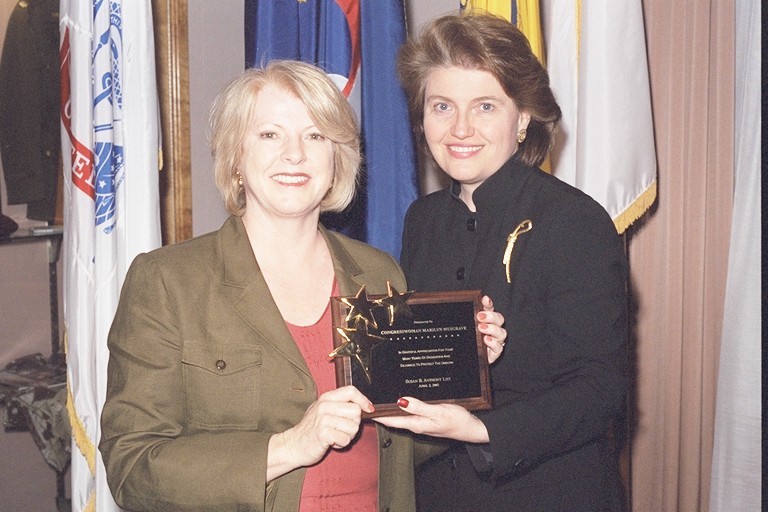 Jane Abraham presents an award to Representative Marilyn Musgrave (left) at an SBA List event.